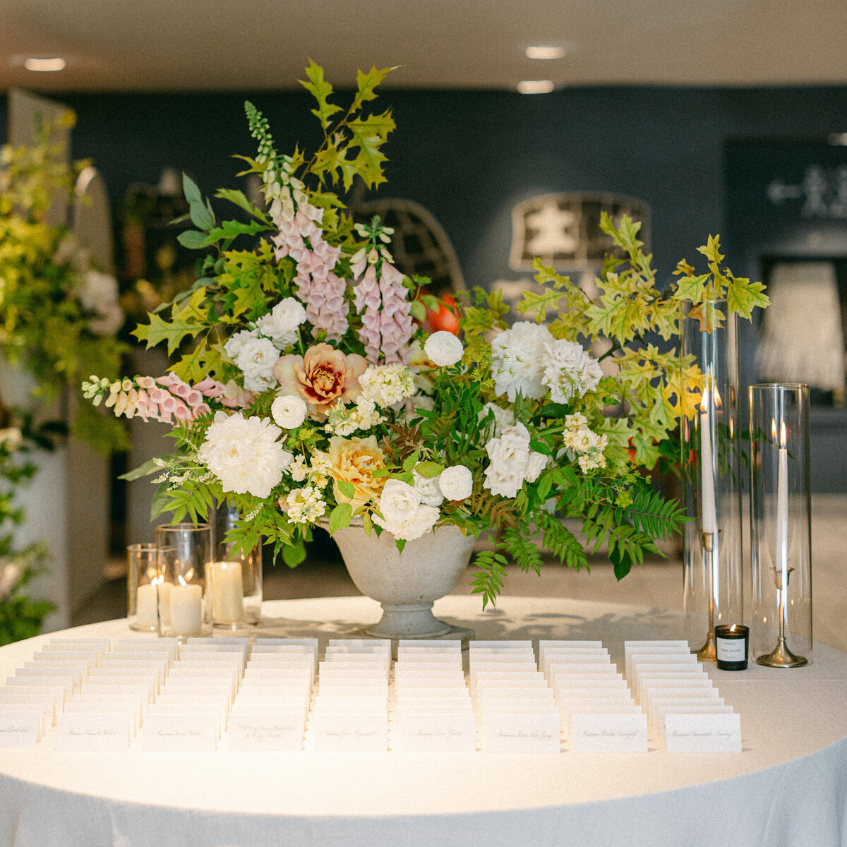An arrangement of lush spring flowers on the place card table of a La Toundra wedding.