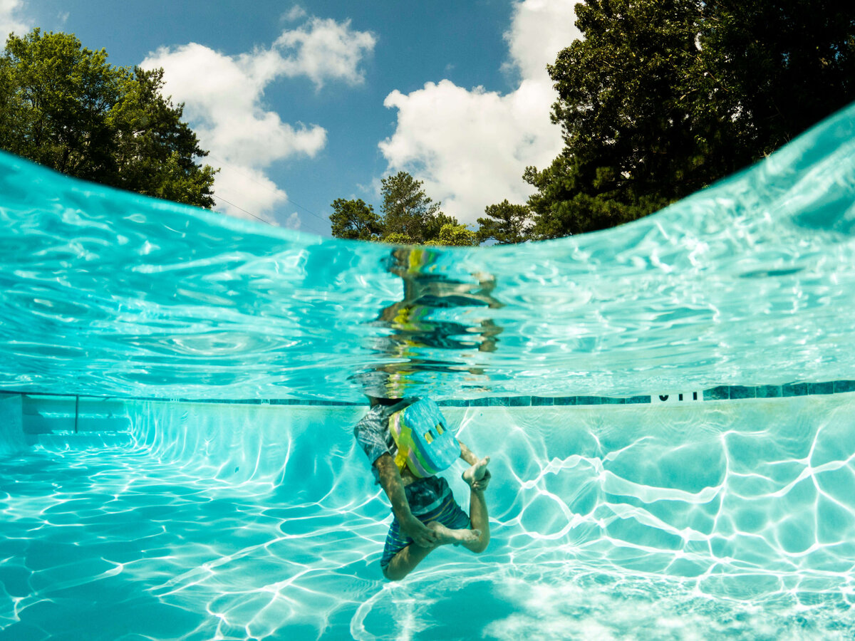 Boy underwater in pool