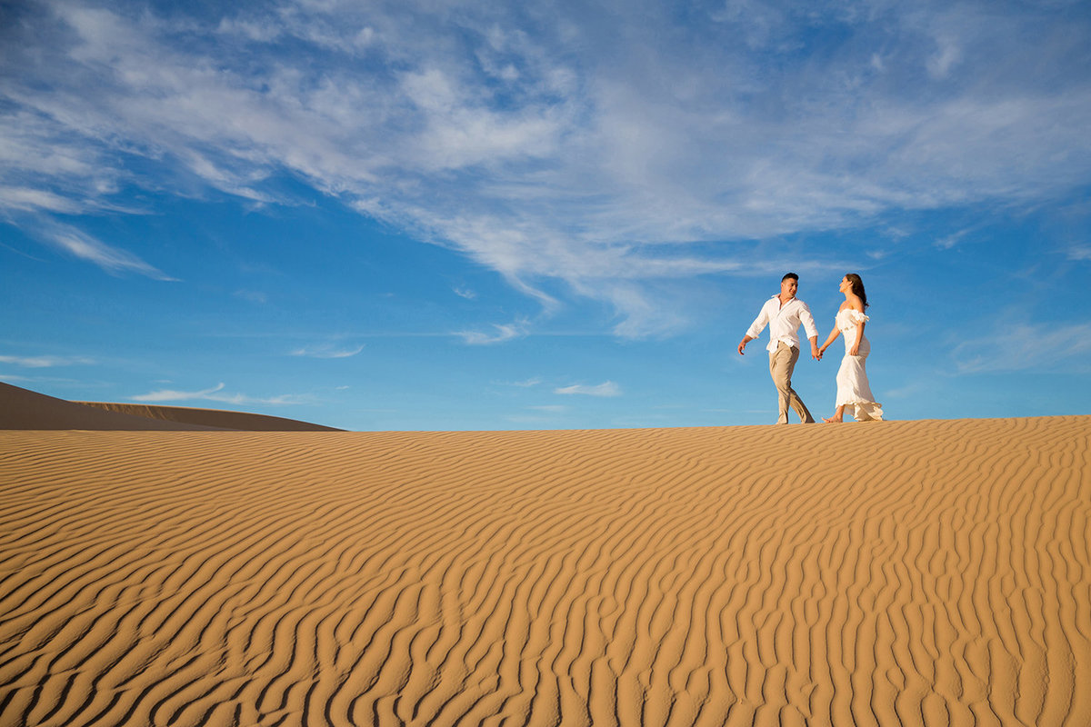Wedding Couple Walking on Giant Sand Dunes in Glamis