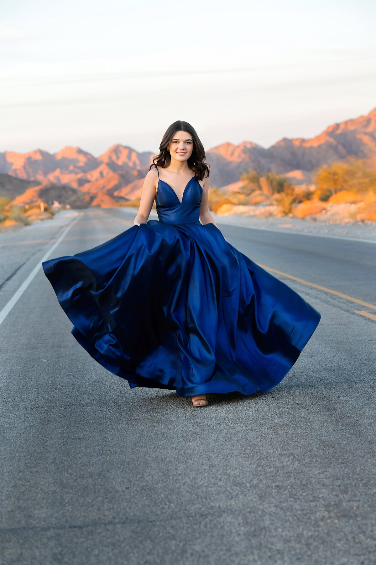 girl blue dress in desert road
