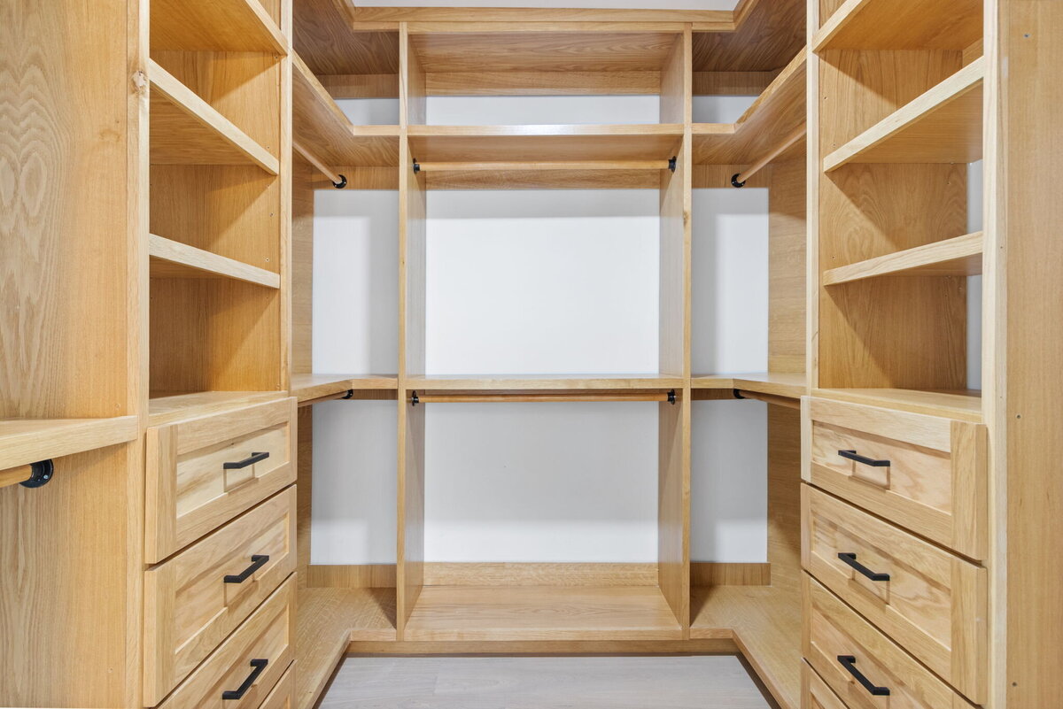 modern-walk-in-closet-natural-wood-shelving-custom-built-storage