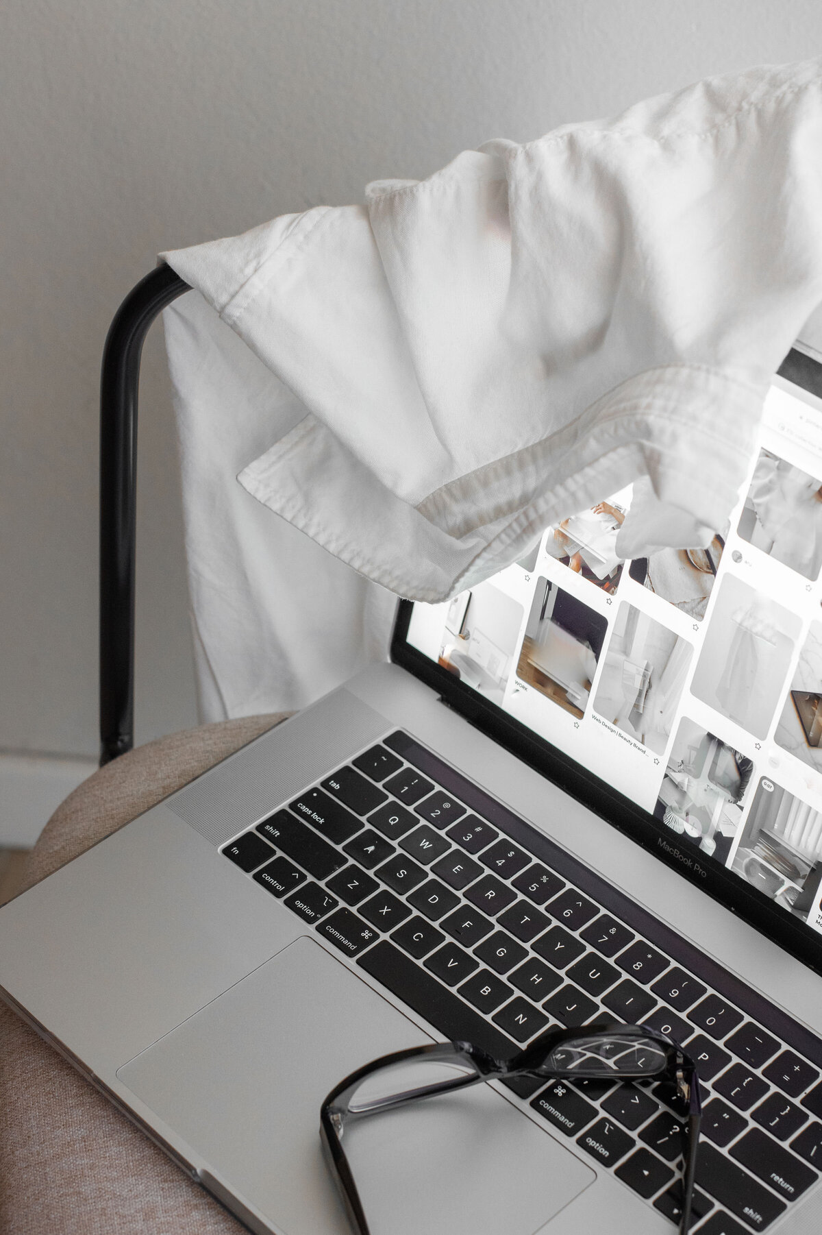 Laptop open with inspirational photo moodboard for a stock collection
