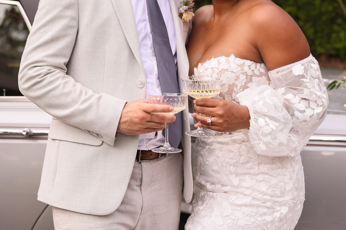 bride and groom holding champagne glasses at Dr Phillops House in Orlando  Florida by Orlando Wedding Photographer Amanda Richardson Photography
