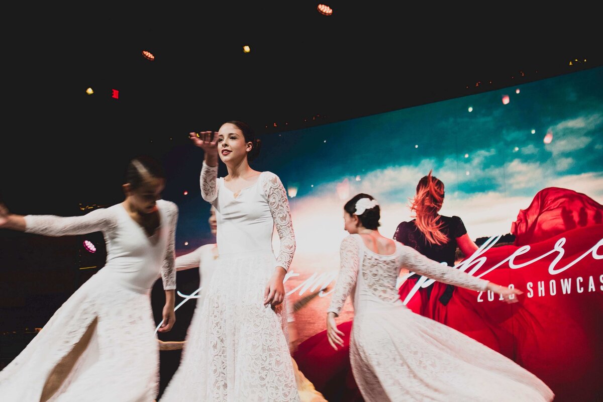 Dancers in white at showcase in Southlake Texas