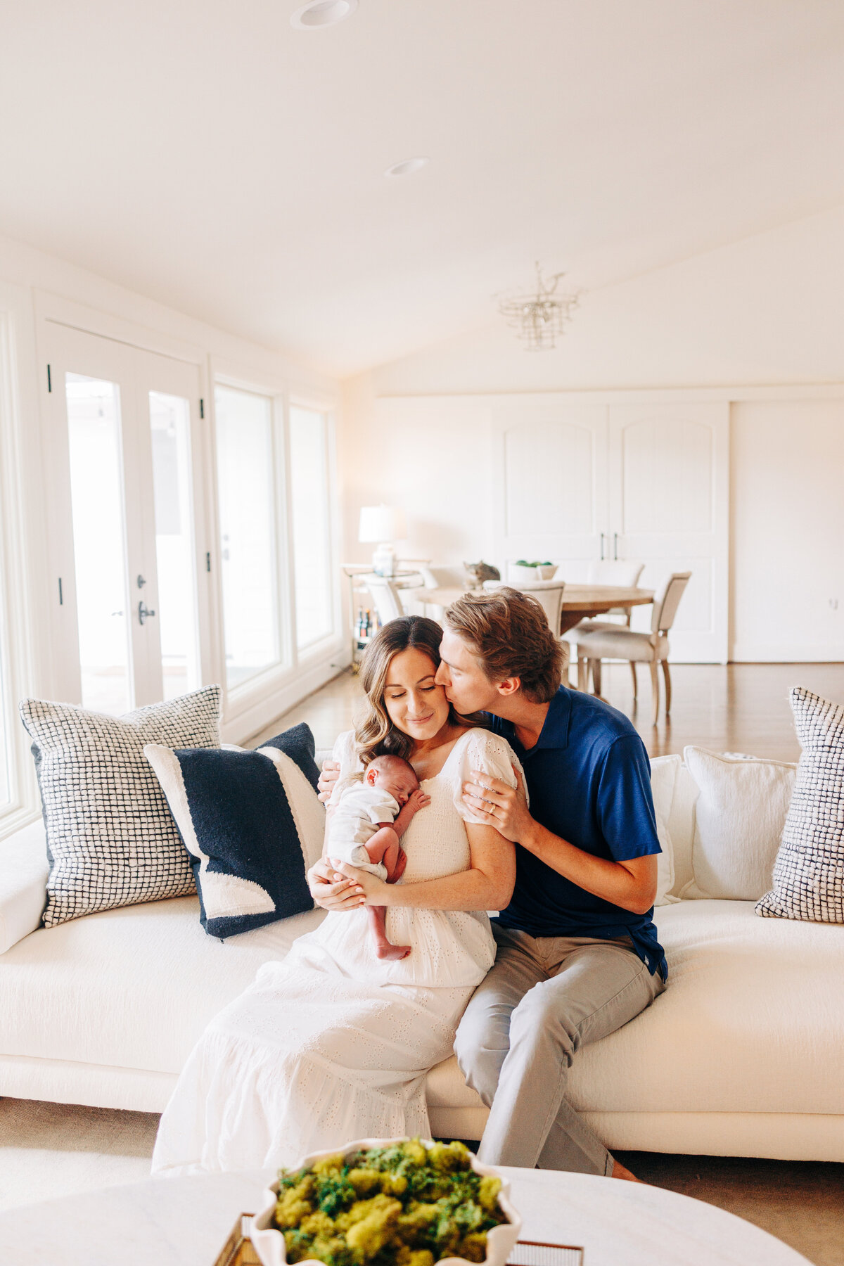 family of 3 during an in home newborn session in Houston, Texas