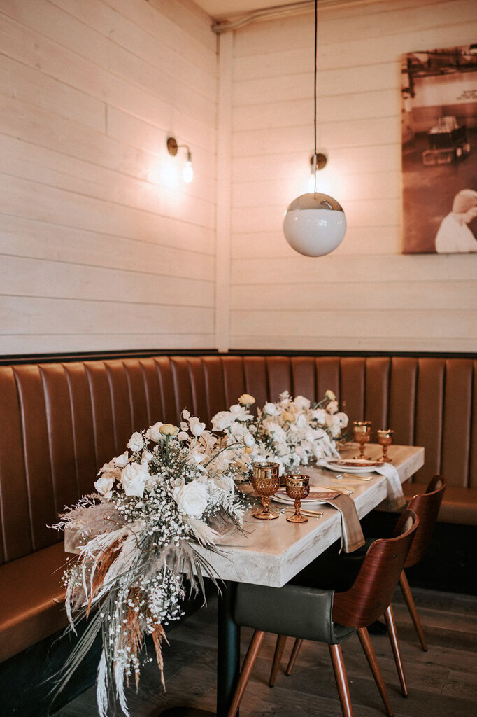 Moody and romantic wedding reception at restaurant styled by Melissa Alison Events, a genuine and modern wedding planner based in Calgary, Alberta. Featured on the Brontë Bride Vendor Guide.
