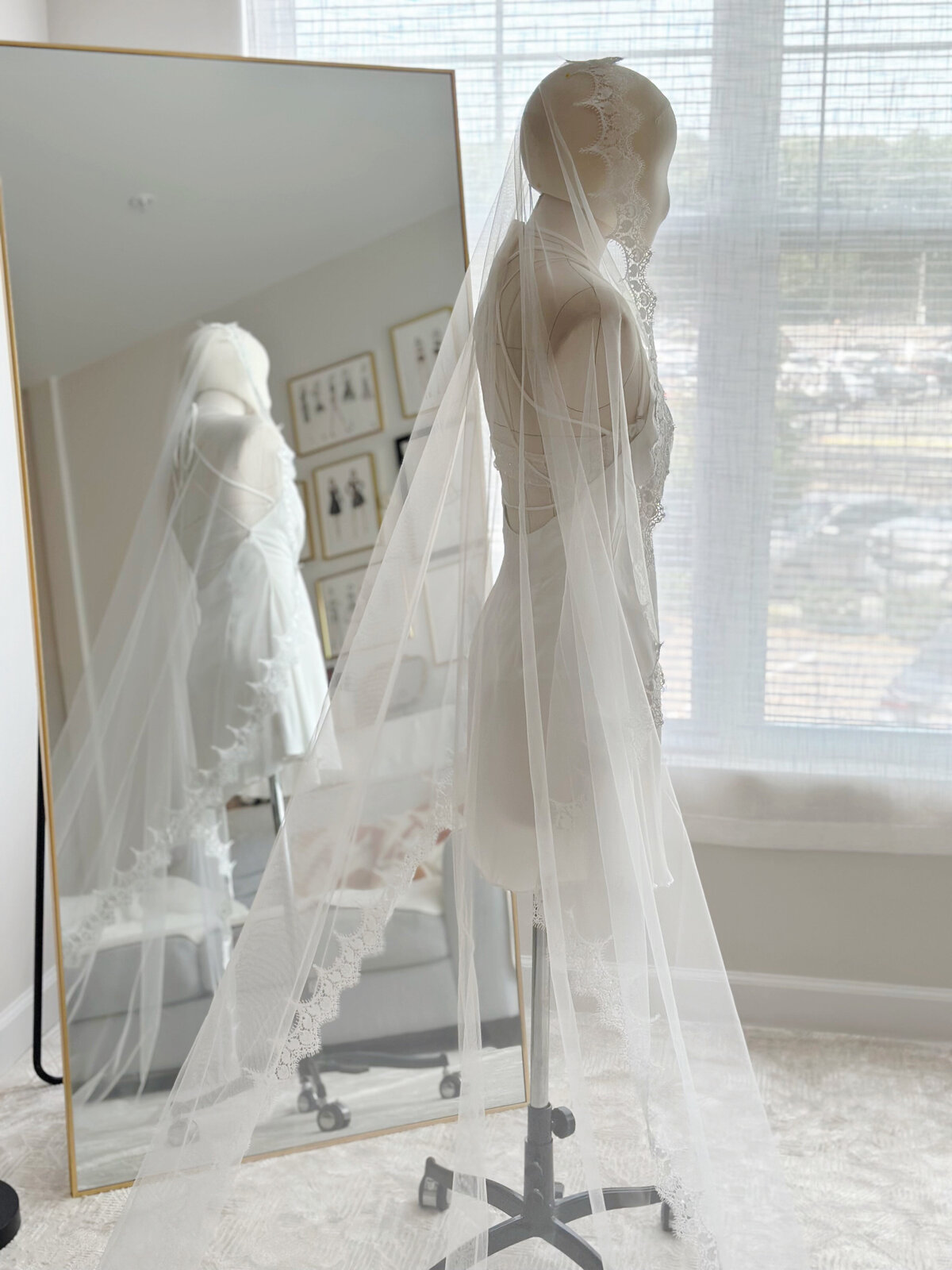 Soft tulle mantilla bridal veil draped gracefully over shoulders