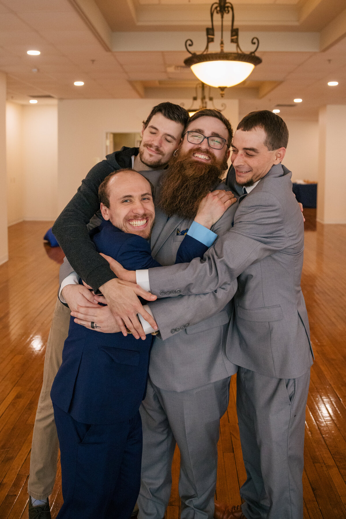 A tattooed couple laughing during their Springfield, MO elopement, captured by Chelsea Stanford.