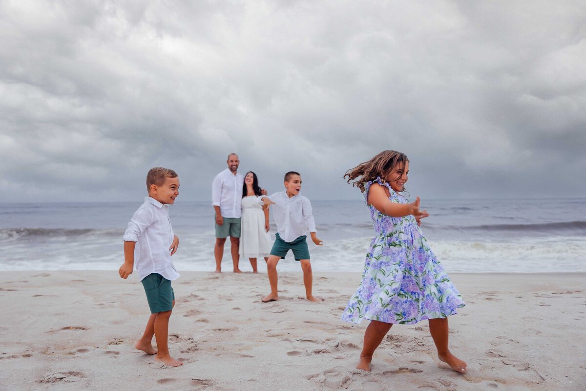 family playing on beach long island family photography