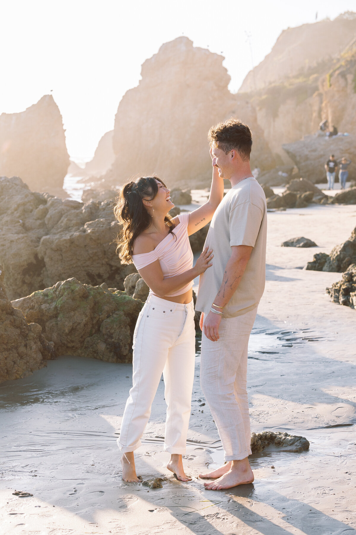 A woman running her hand through her partner's hair