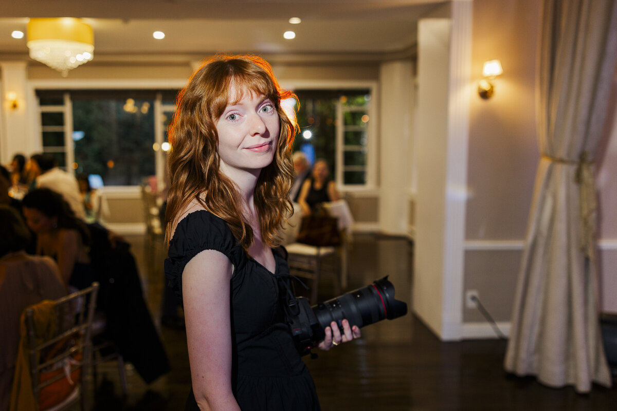 Megan photographing a wedding reception as part of the Megan and Kenneth photo and video team