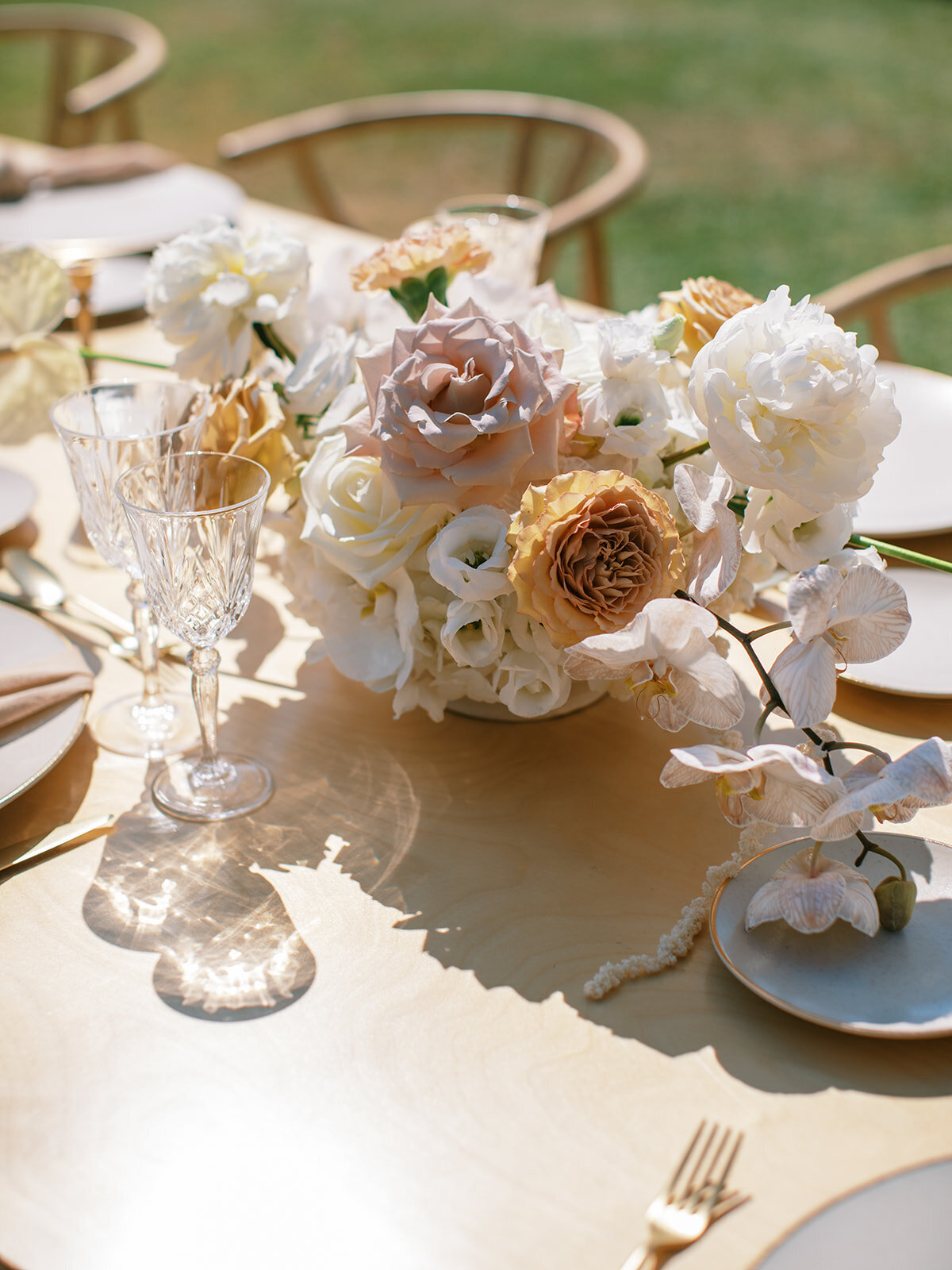 neutral wedding floral centerpieces at outdoor reception