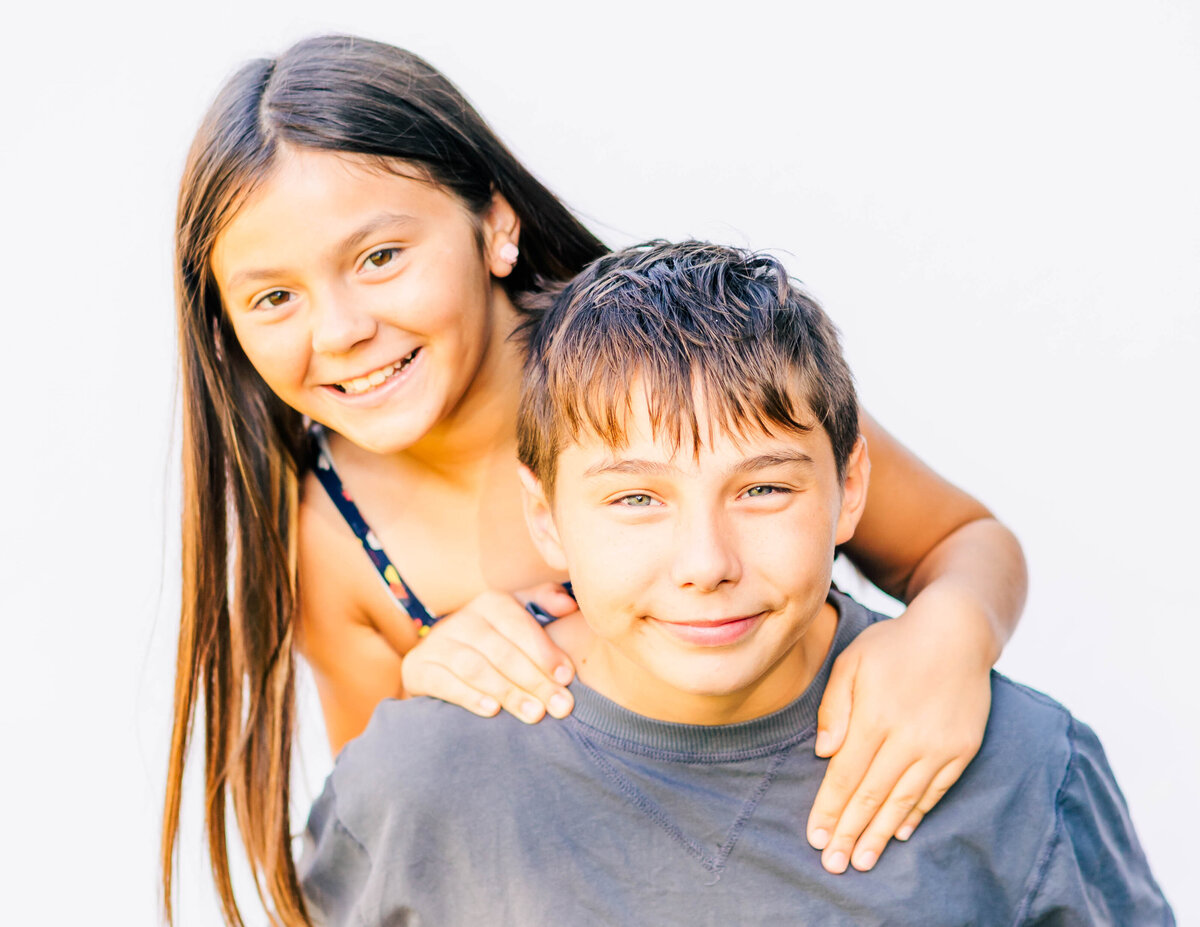 Sibling portrait of brother and sister smiling together — fine art school photography by S. Reed Photography
