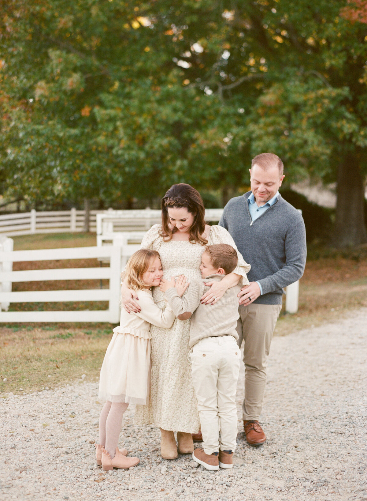 Family of 4 gets ready to welcome their new baby. Image by Raleigh maternity photographer A.J. Dunlap Photography.