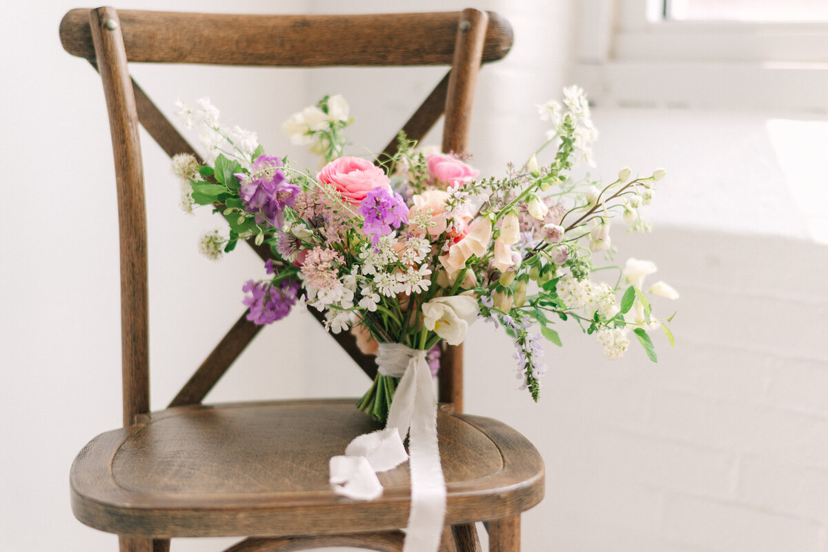 Pink Ranunculus, Purple sweet peas, and orange poppies