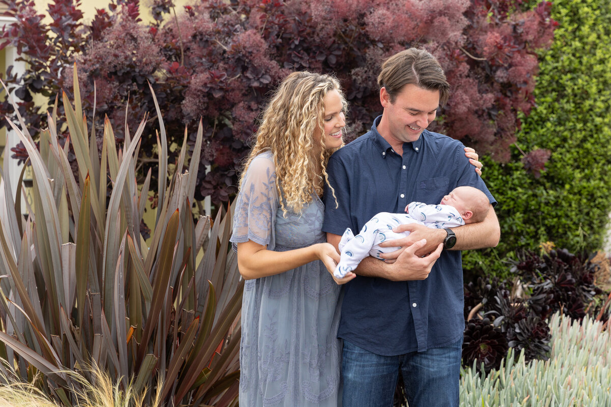 Couple looking at his newborn son