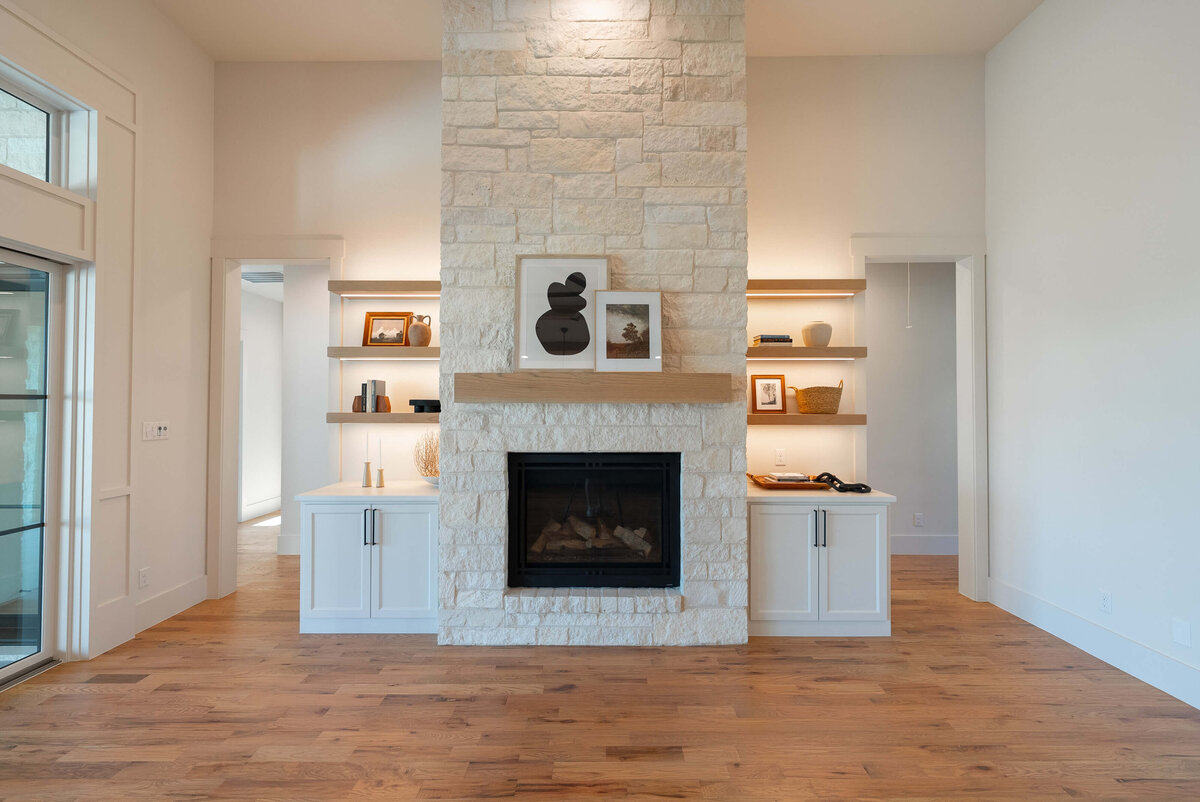 Custom home living room with stone fireplace