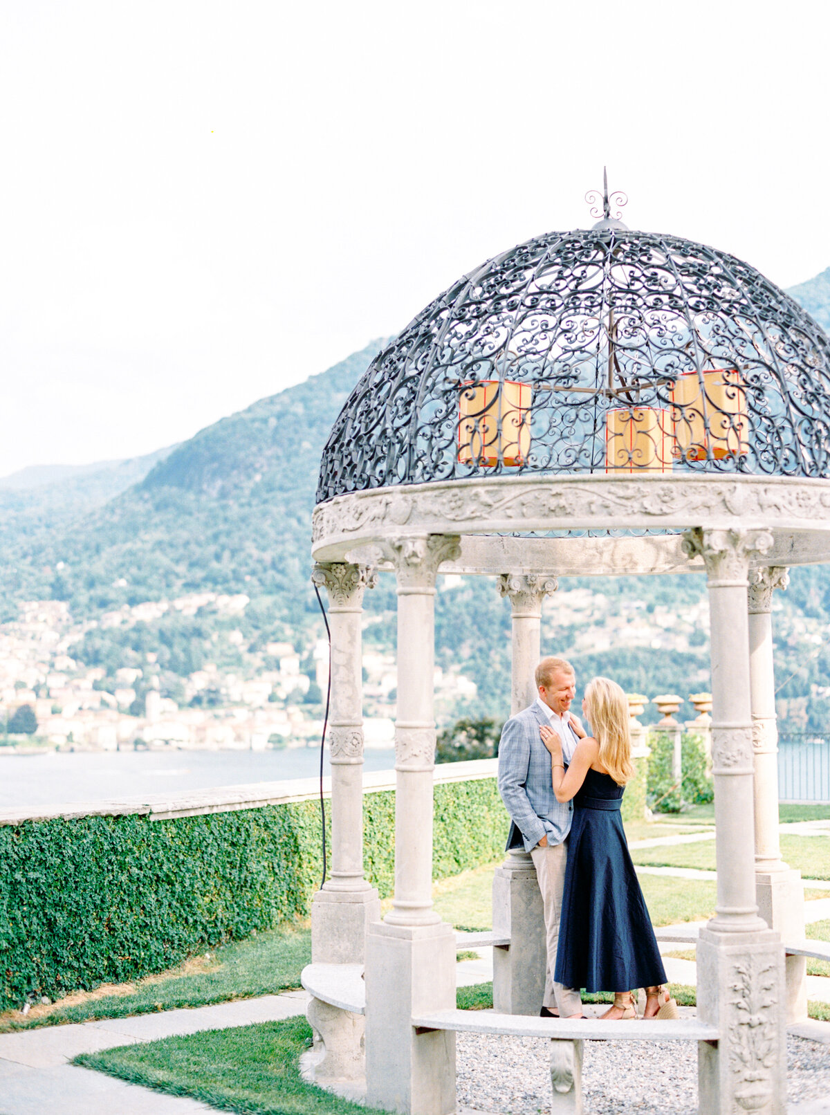 Film photograph of bride and groom under a gazebo for their engagement session at Passalacqua on Lake Como Italy