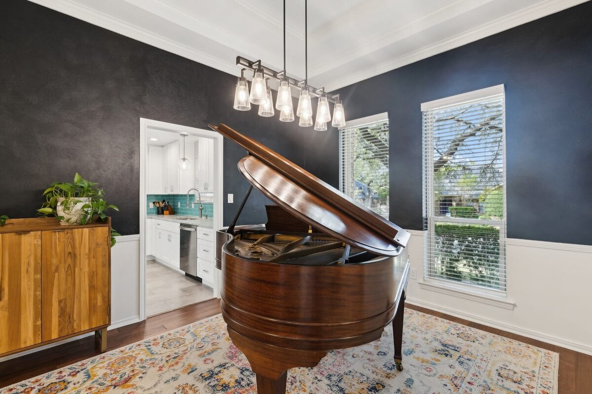 10216_shadow_way_dallas_tx_music_room_-_grand_piano_space_with_navy_accent_wall_and_natural_light_-_haven_realty_group