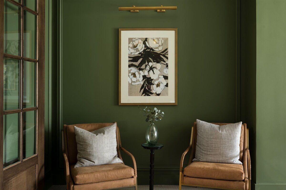 intimate study with green wall and painting photography
