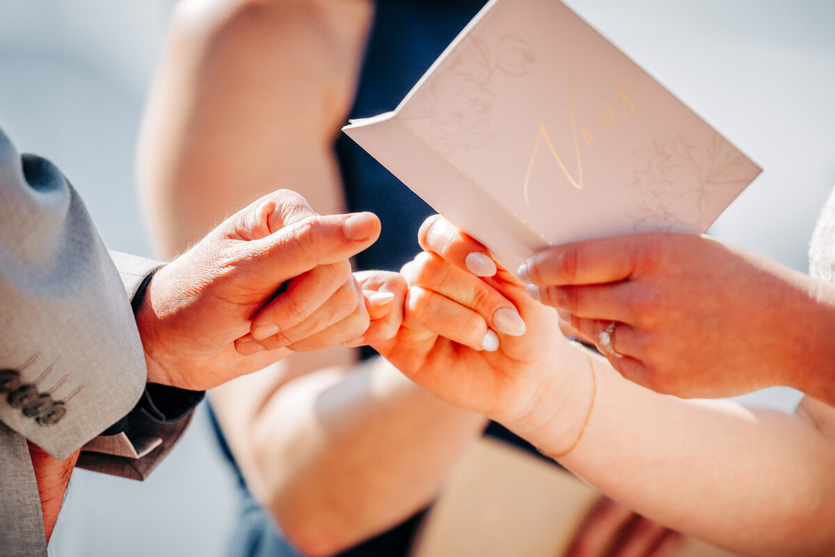 Close up bride groom hands ceremony at Everett's 8800 in Big Sky, MT