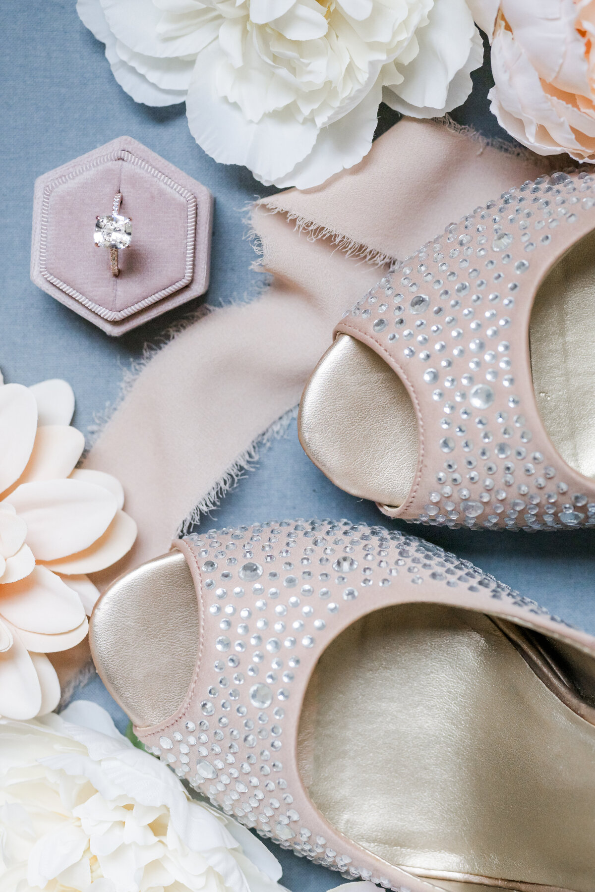wedding day flat lay with ring and shoes