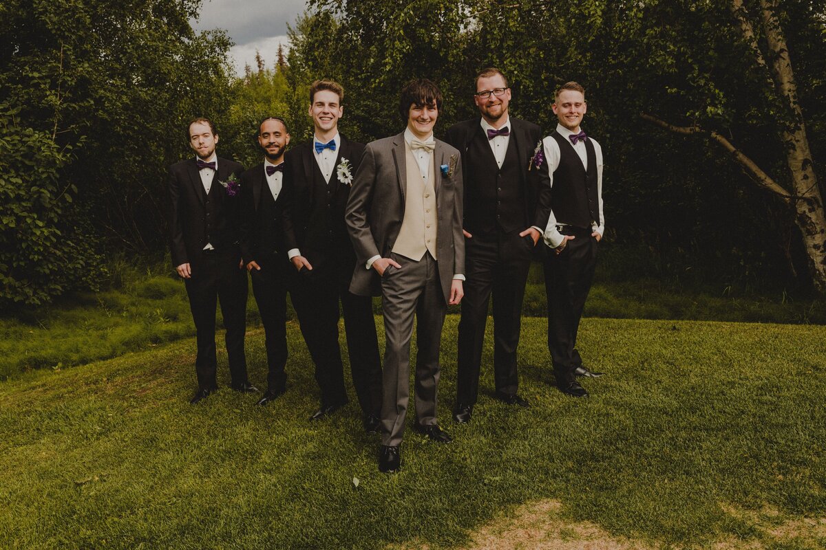 Groomsmen show off their suits