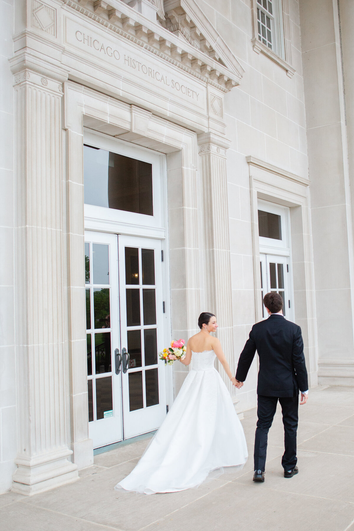bride and groom at the chicago history museum on their wedding day