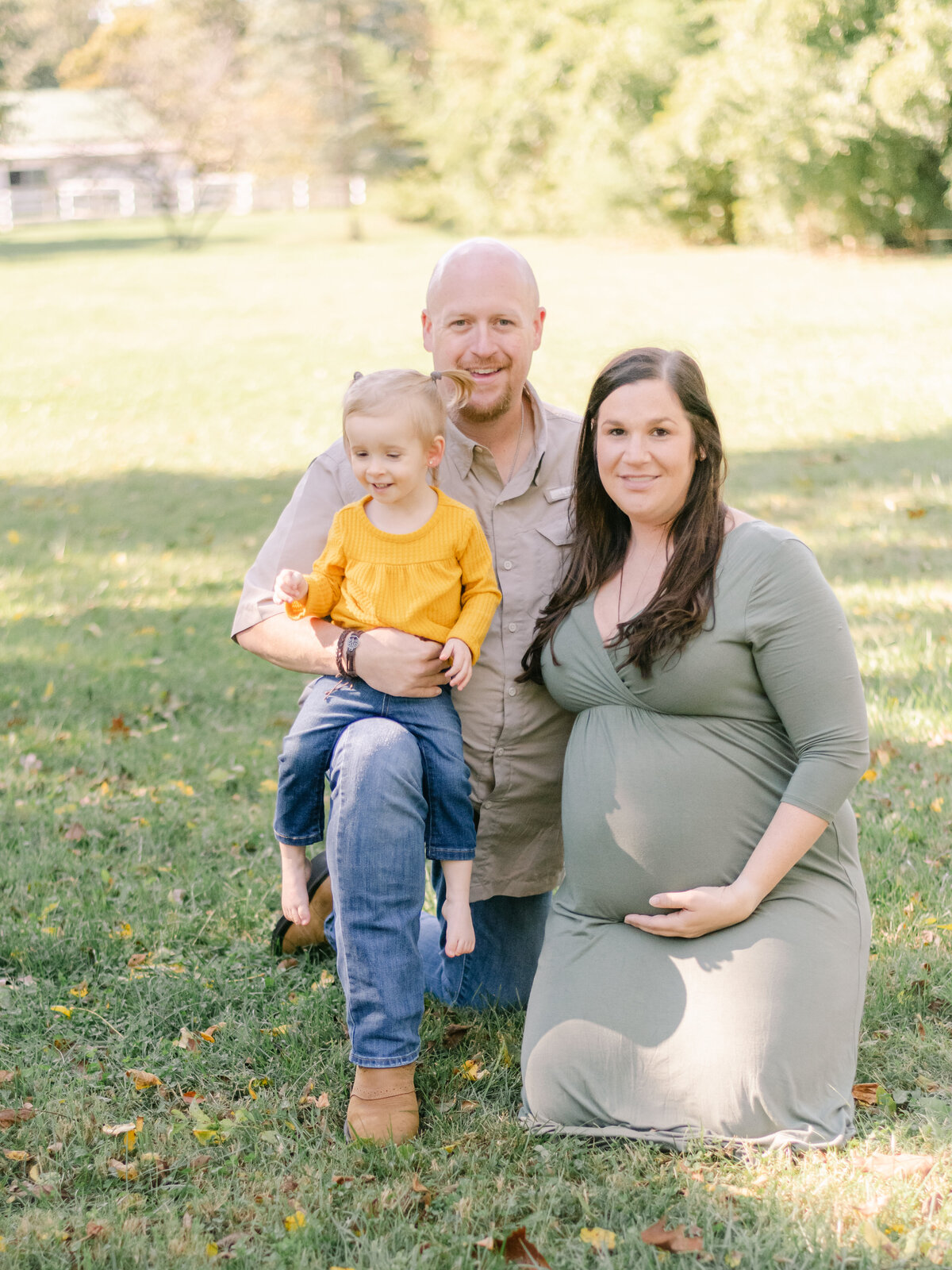 Young growing family with Mom who is expecting second child.