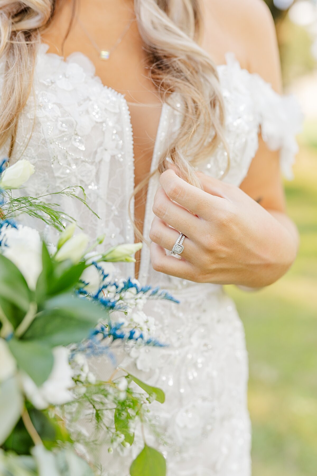 bride-holding-hair-and-bouquet-freedom-hill