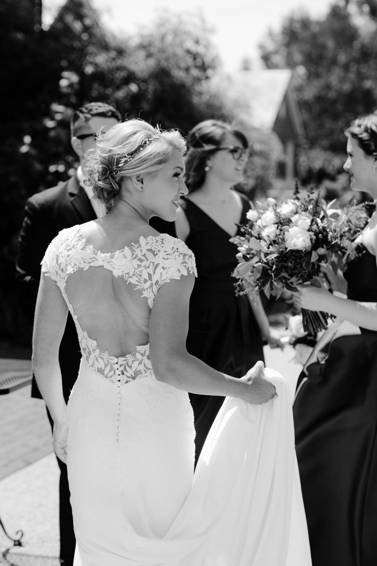 a bride looking back at her bridesmaids