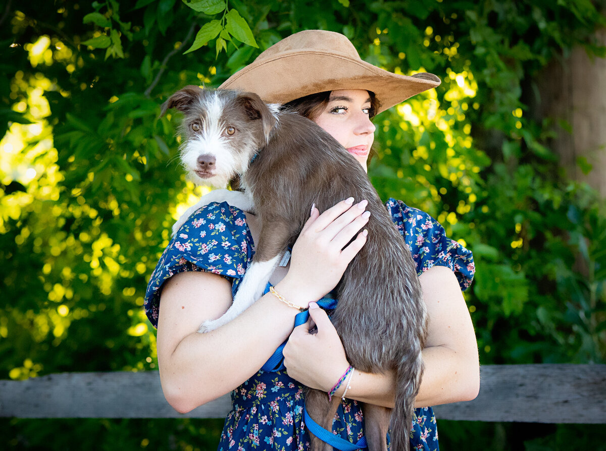 senior girl brings dog to fortworth stockyards for pictures