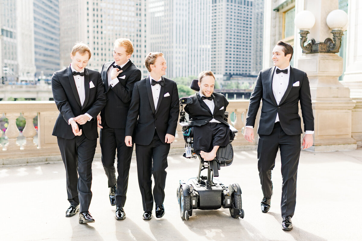 15_groomsmen_walking_and_laughing_downtown_chicago