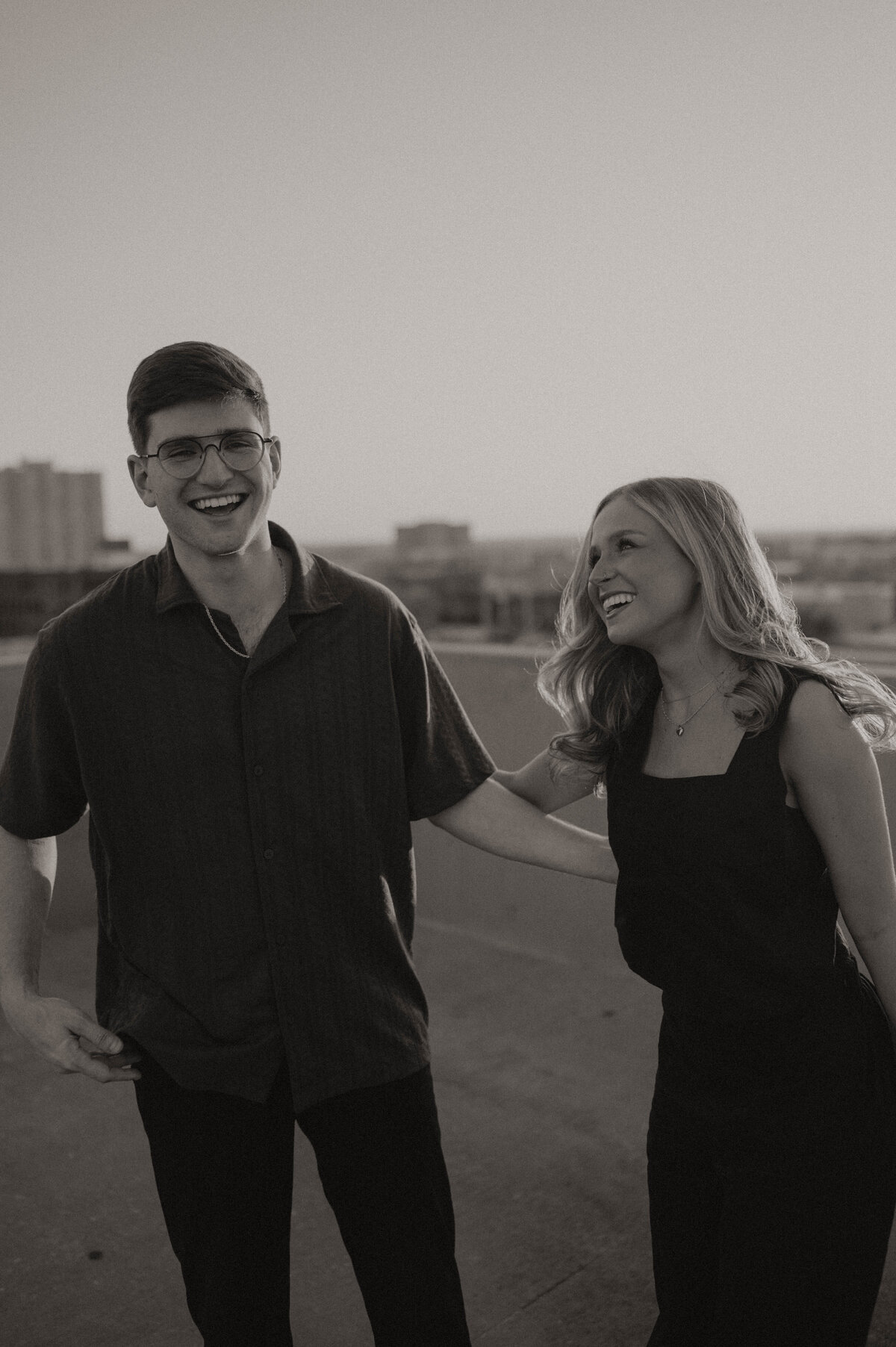 Couple laughing during golden hour in oklahoma city