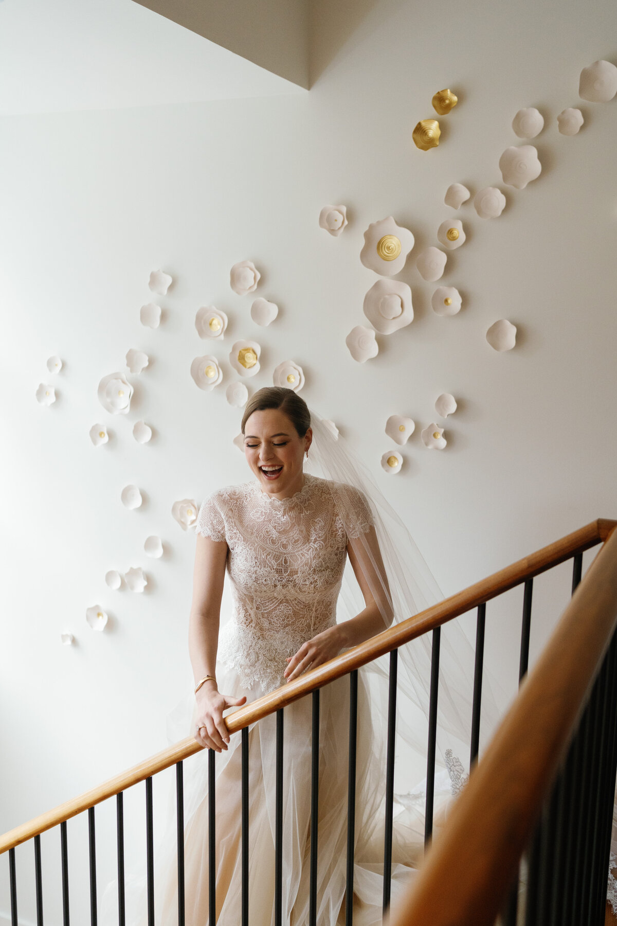 Bride getting ready for her Dallas wedding, wearing a lace and tulle gown by Vera Wang