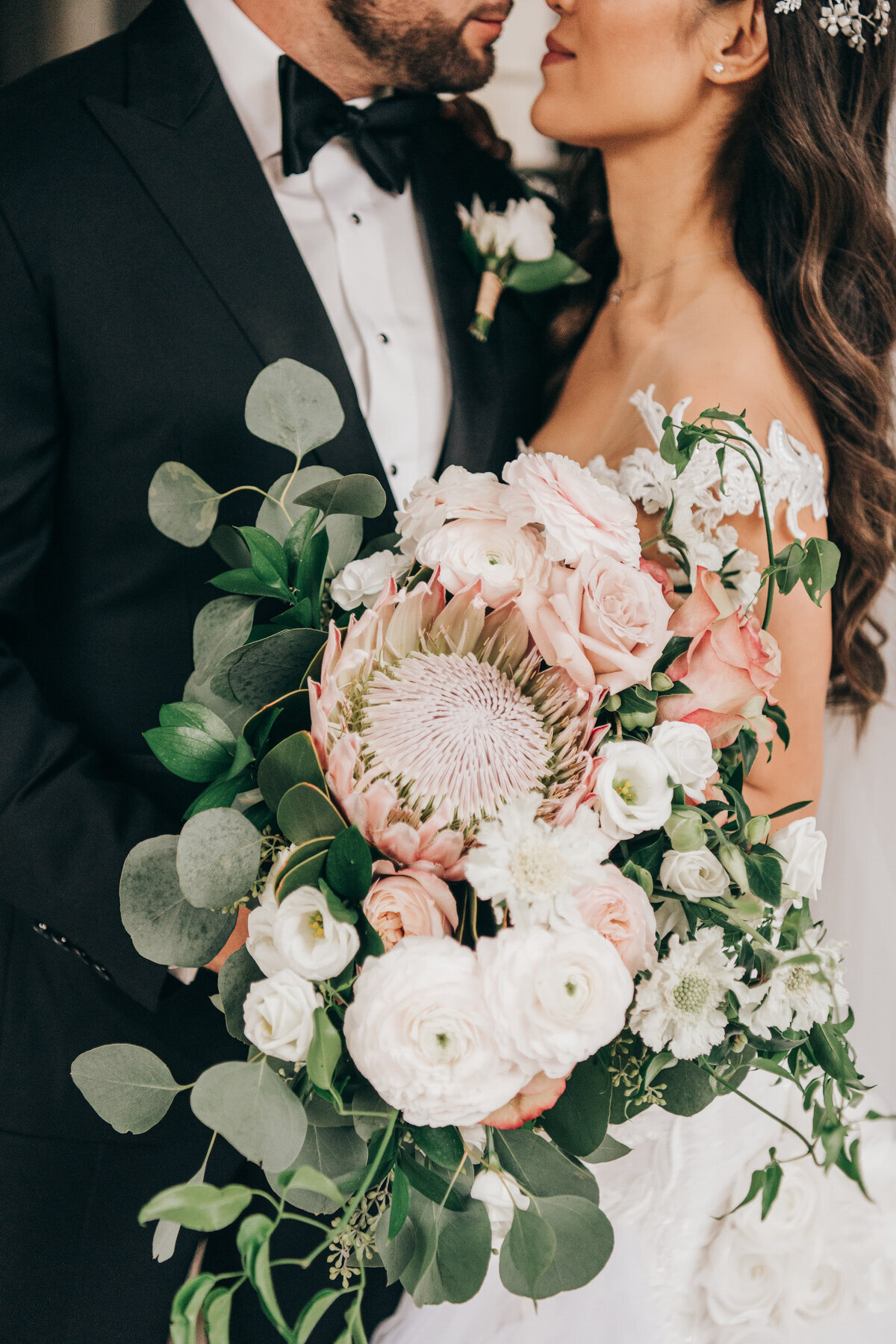 Glamorous bouquet of eucalyptus, chrysanthemums, and roses