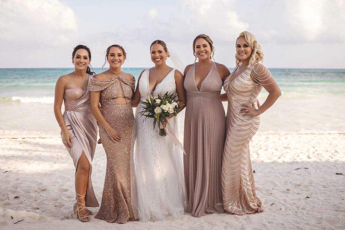 Bride with bridesmaids at wedding in Riviera Maya