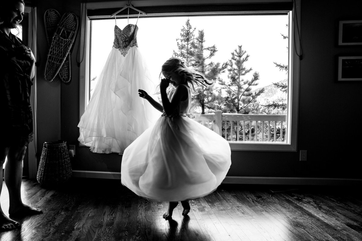 Flower Girl Twirls at elopement in Rocky Mountain National Park