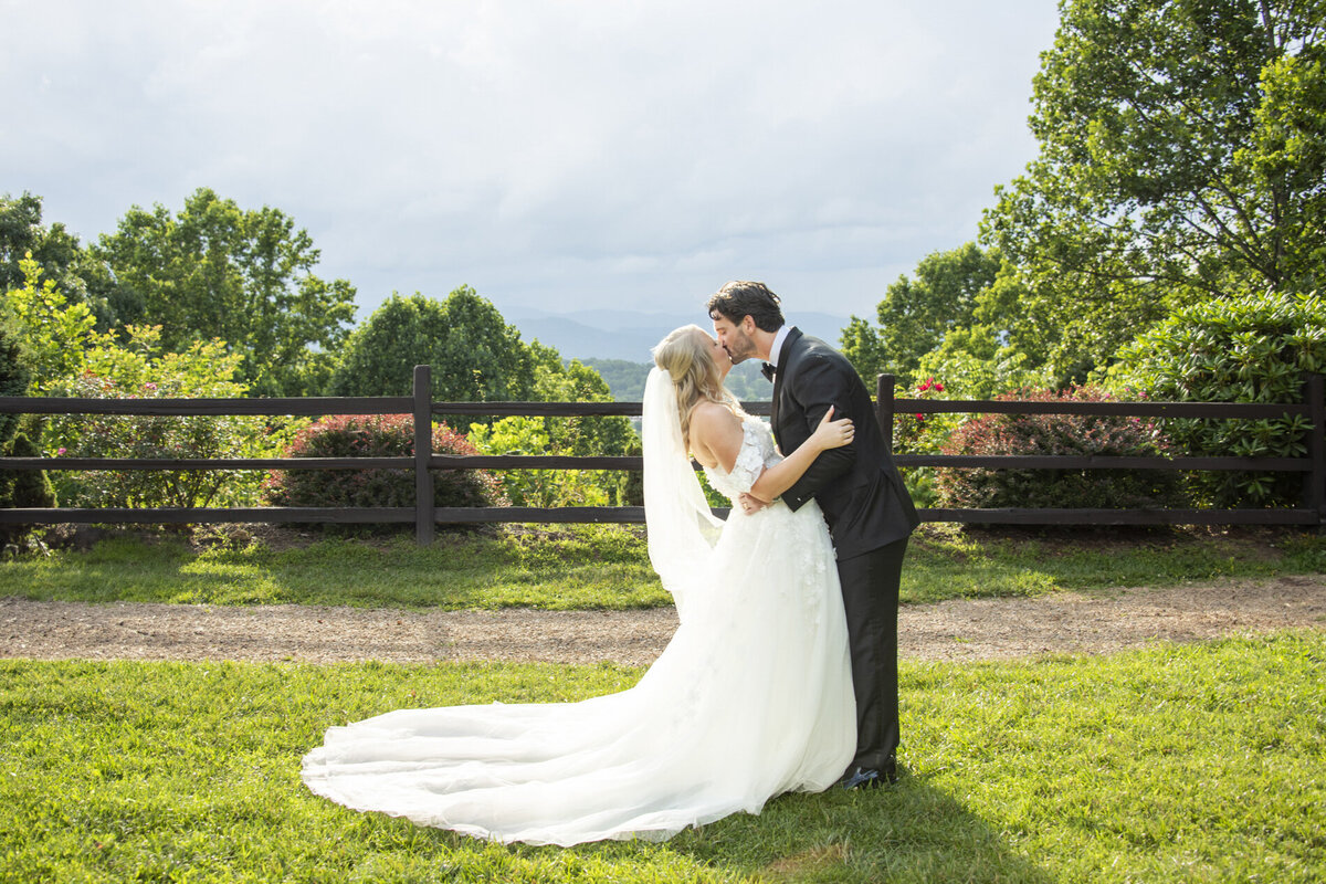 Couple kissing at Crest Pavilion Asheville wedding 
