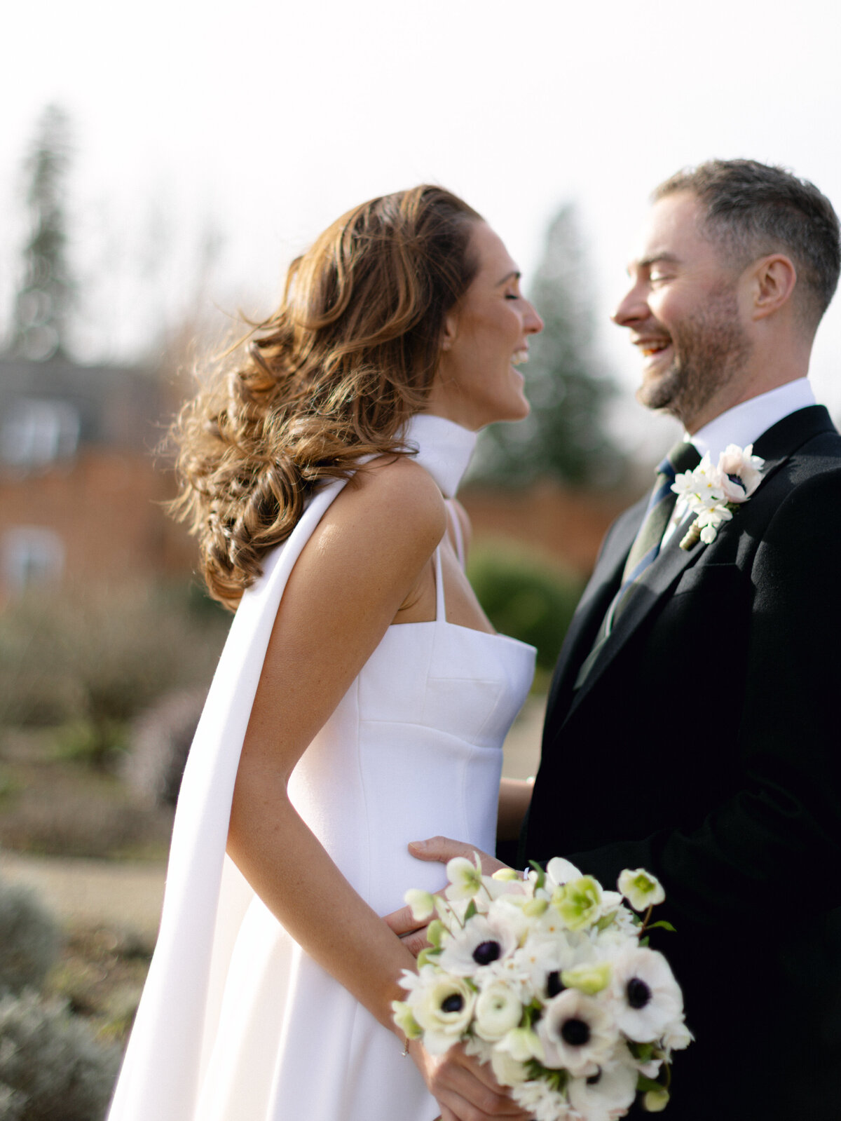 Bride and groom smiling at Heckfield Place