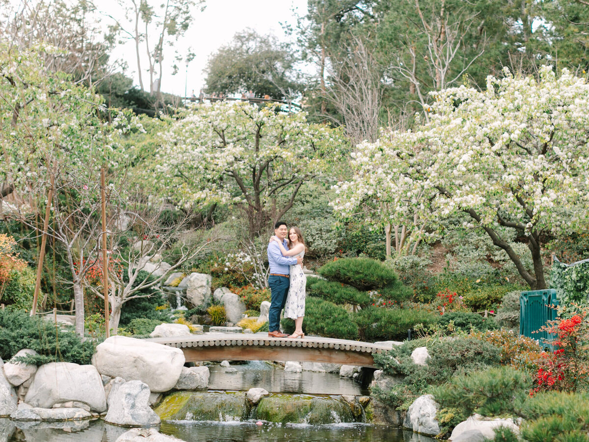 couple on bridge at japanese garden in balboa park san diego