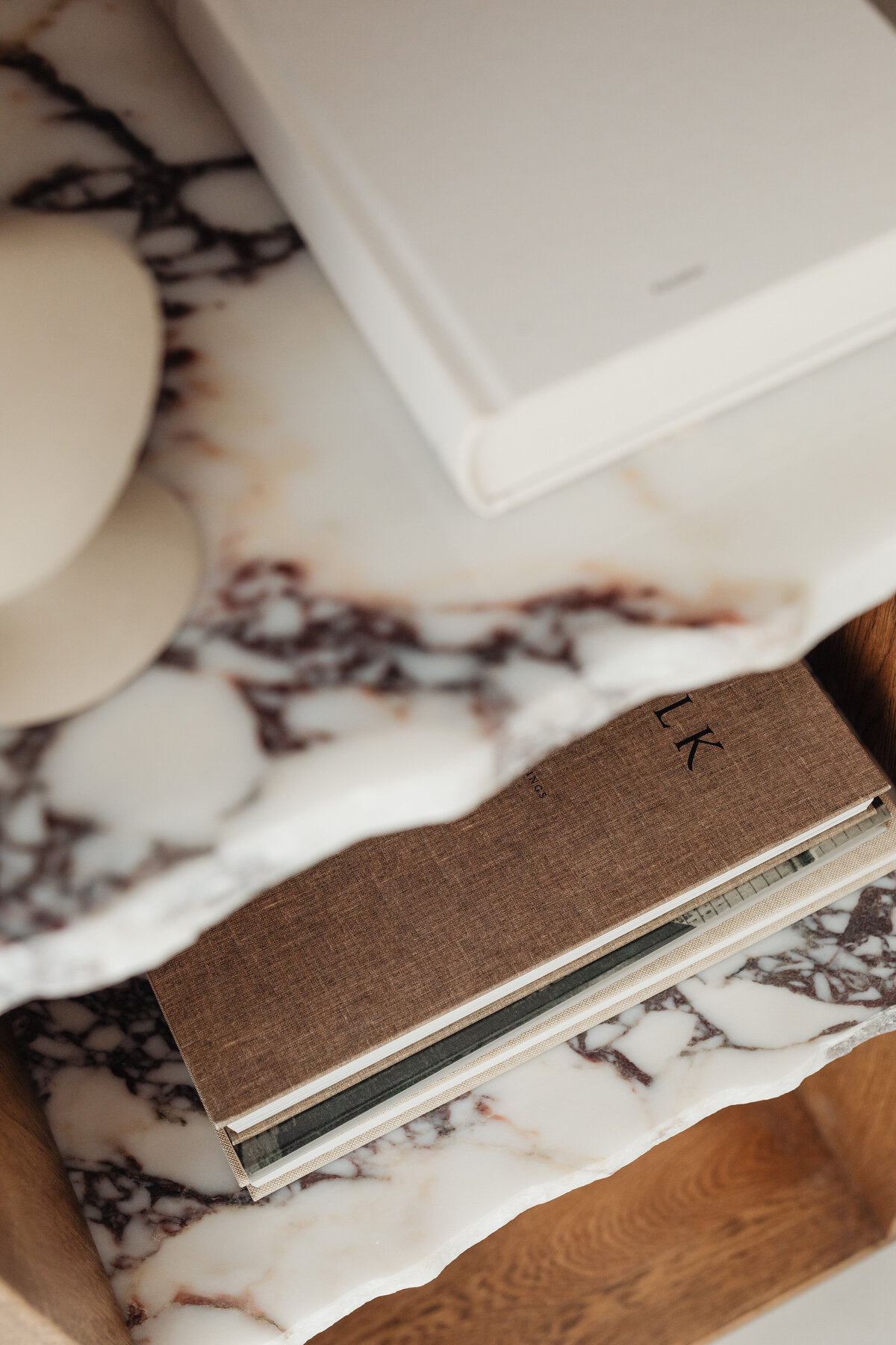 kaboompics_books-on-a-bookcase-marble-shelves-27384