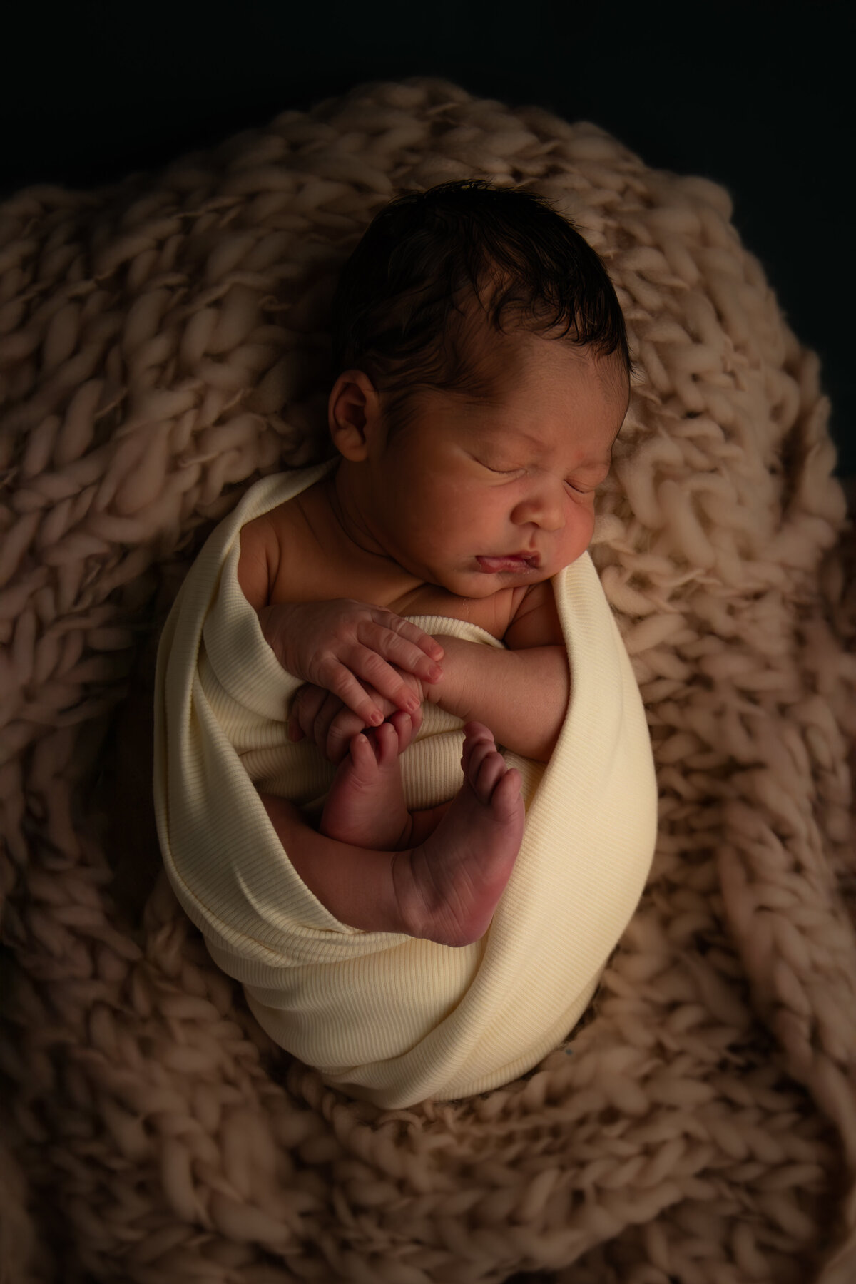 newborn baby wrapped for pictures