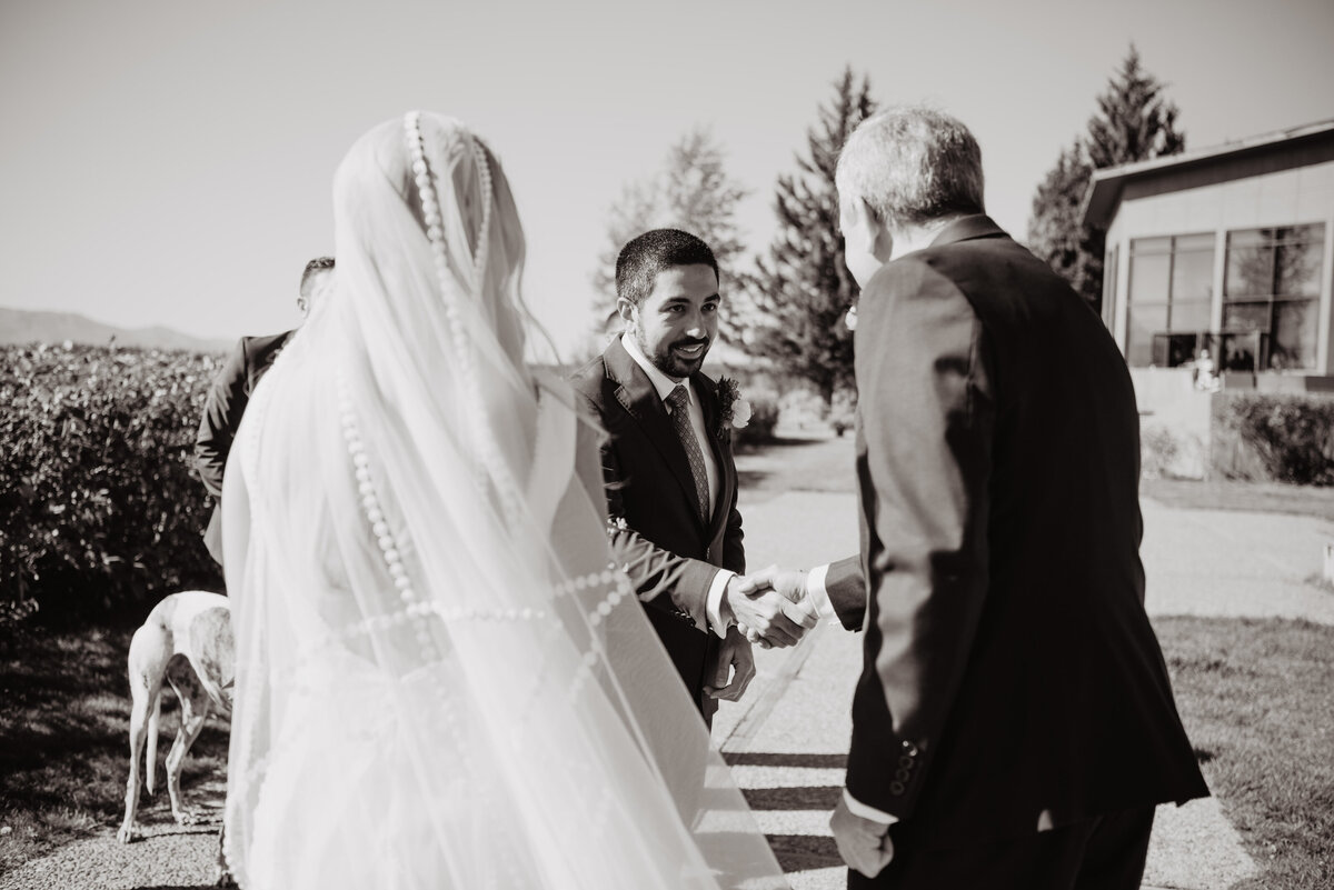Photographers Jackson Hole capture groom shaking Bride's father's hand