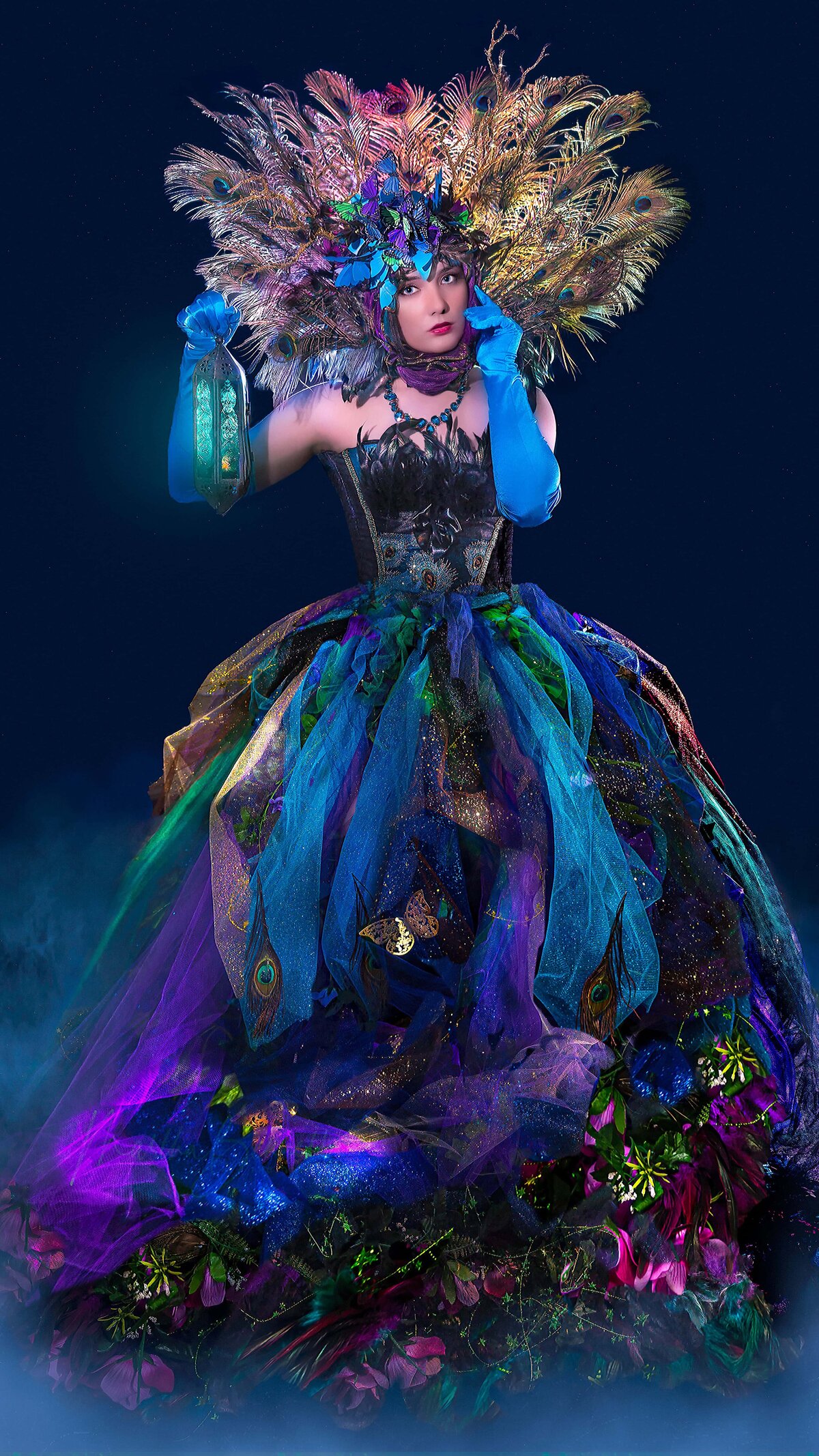 Woman in Peacock outfit holding lantern 