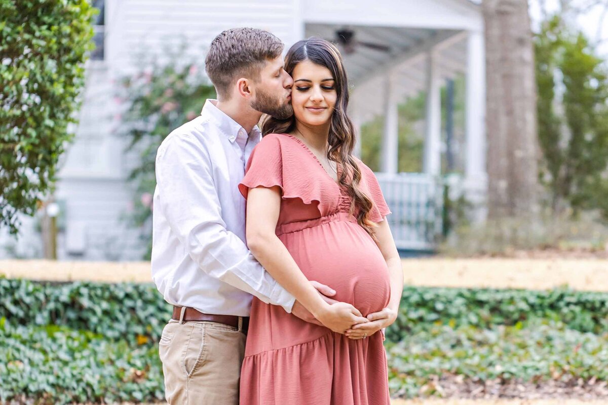 husband and wife maternity image expecting their second child