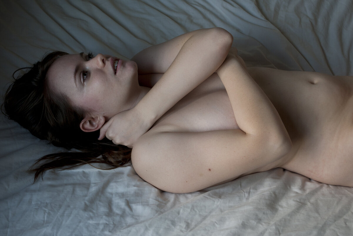 nude portrait on bed