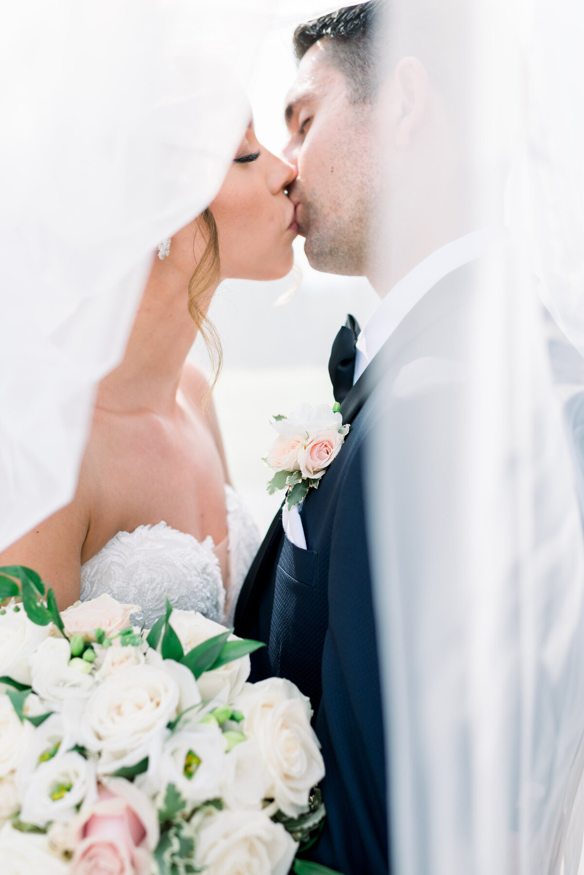 Bride and Groom kissing photo at Glenemere Mansion in New York.