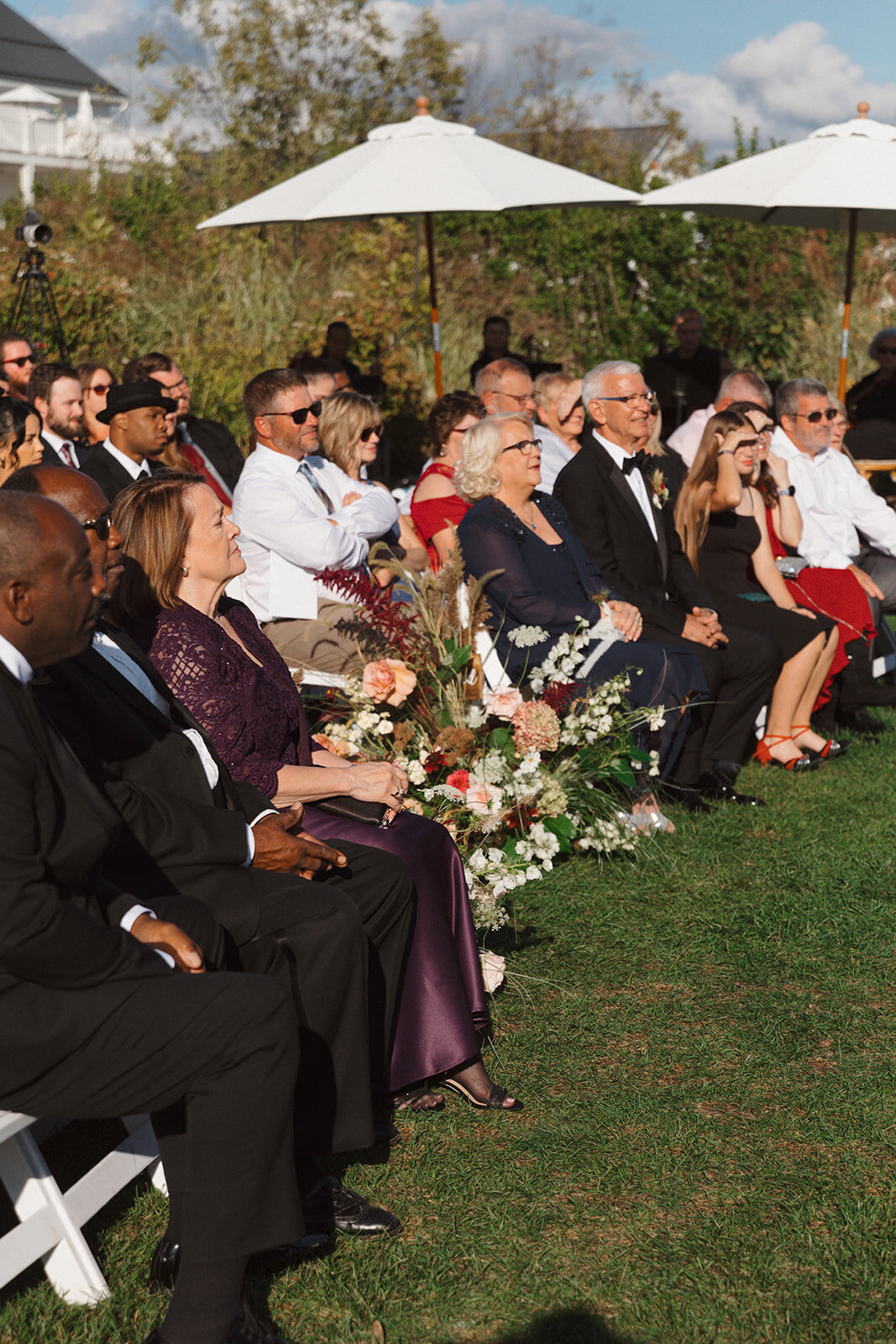 The family and friends at a wedding ceremony at The Lake House on Canandaigua