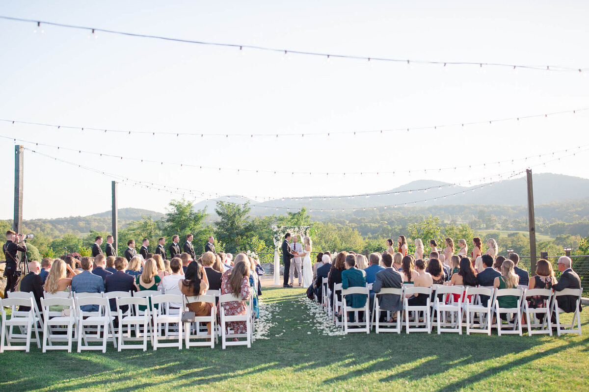 Bride and groom during their wedding ceremony at Blue Valley Vineyard.